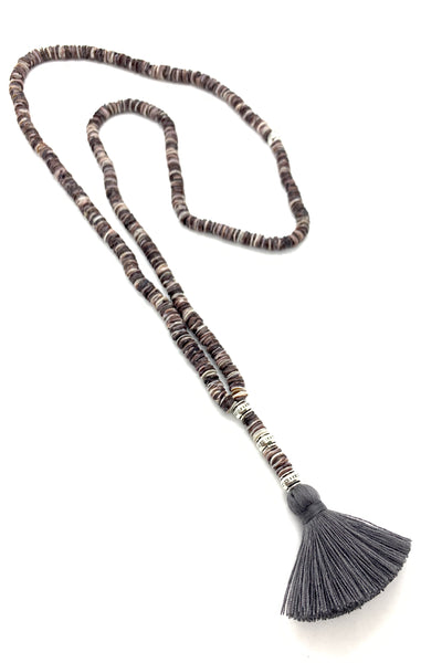 Long necklace with natural shell discs and tassel